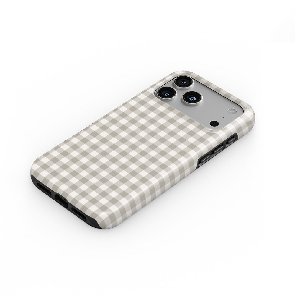 Stone Gingham phone case lying flat at an angle, showing the raised edge profile
