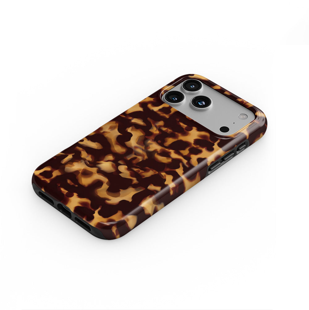 Classic Tortoiseshell phone case lying flat at an angle, showing the raised edge profile