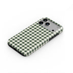 Deep Forest Gingham phone case lying flat at an angle, showing the raised edge profile
