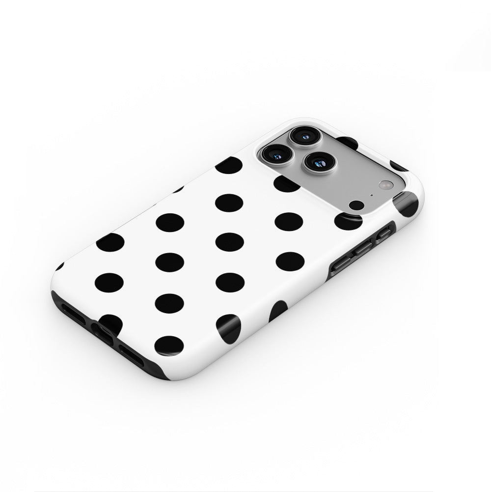 Black in White Polka Dots phone case — steep top-down angle, case lying face up