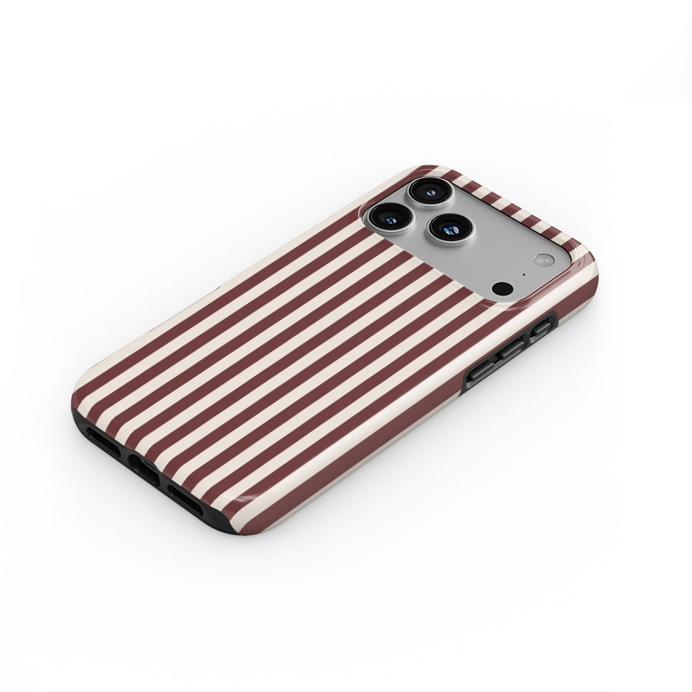 Cherry Mocha Stripes phone case — steep top-down angle, case lying face up