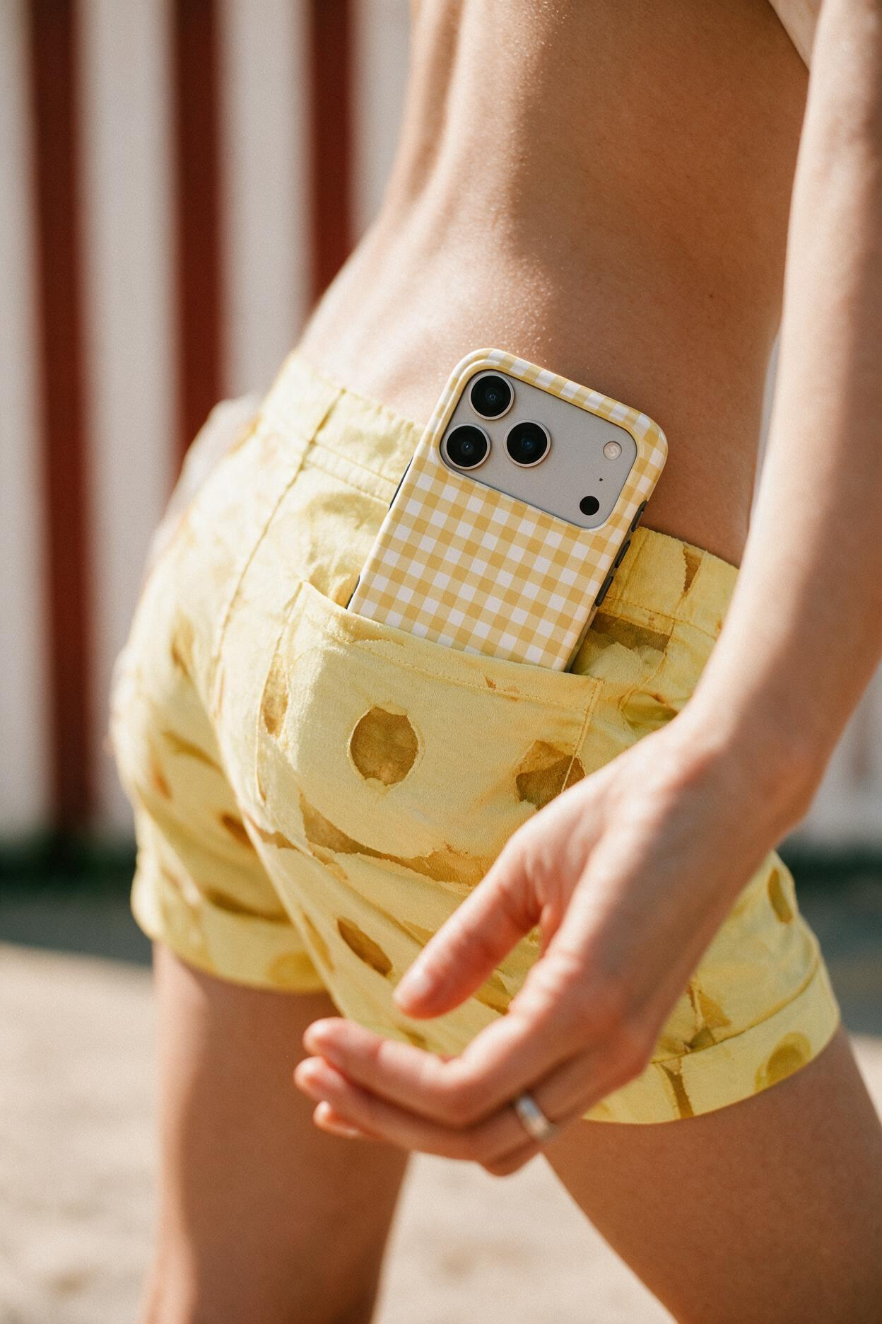 Butter Yellow Gingham phone case, in use