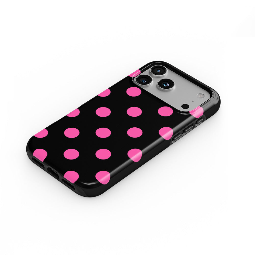 Pink in Black Polka Dots phone case — steep top-down angle, case lying face up