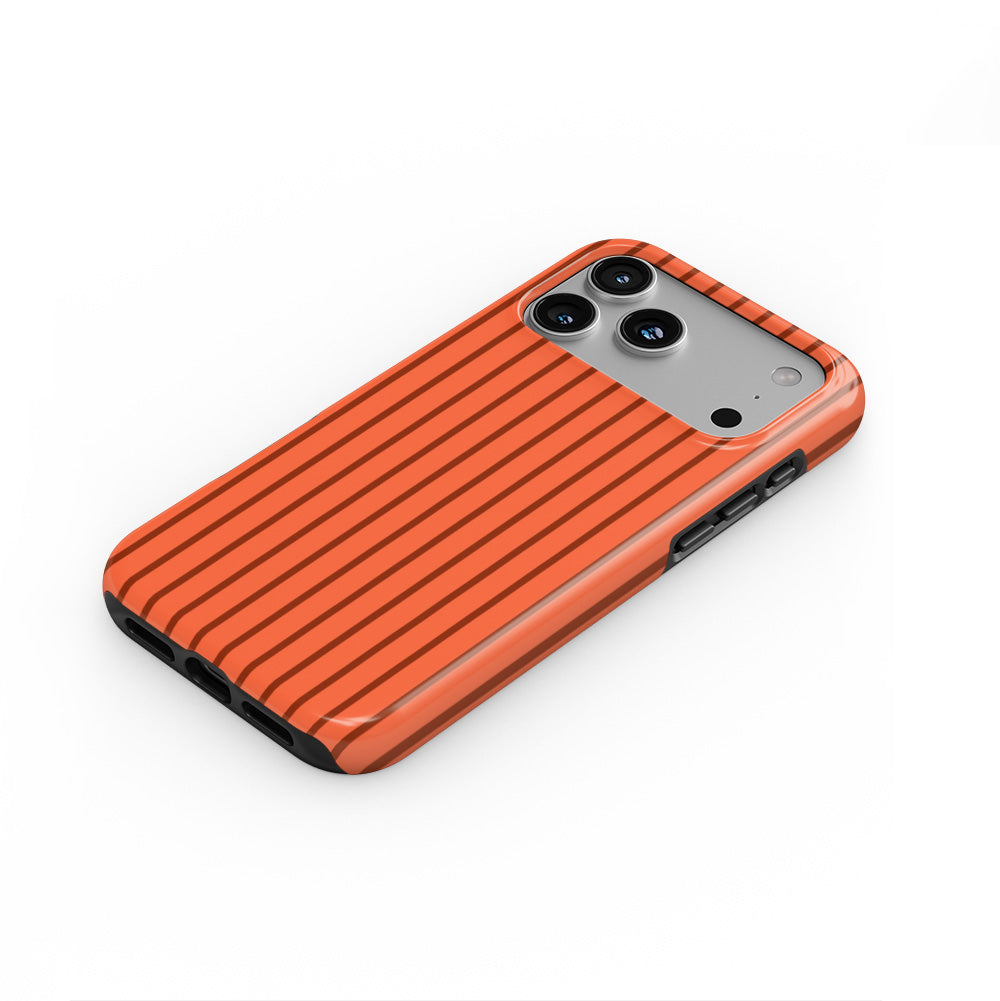 Topaze Orange Stripes phone case — steep top-down angle, case lying face up