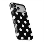 White in Black Polka Dots phone case — slight angle, side edge visible